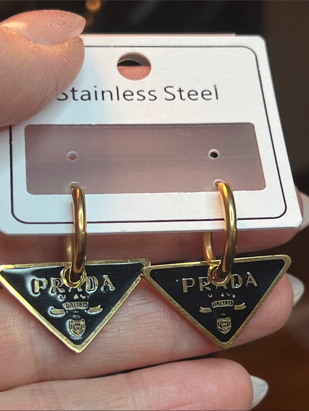 Gold Hoop Earrings with Black Triangle Logo Charms